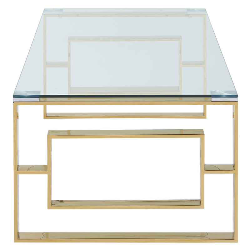 side view of a coffee table with a glass top and gold legs